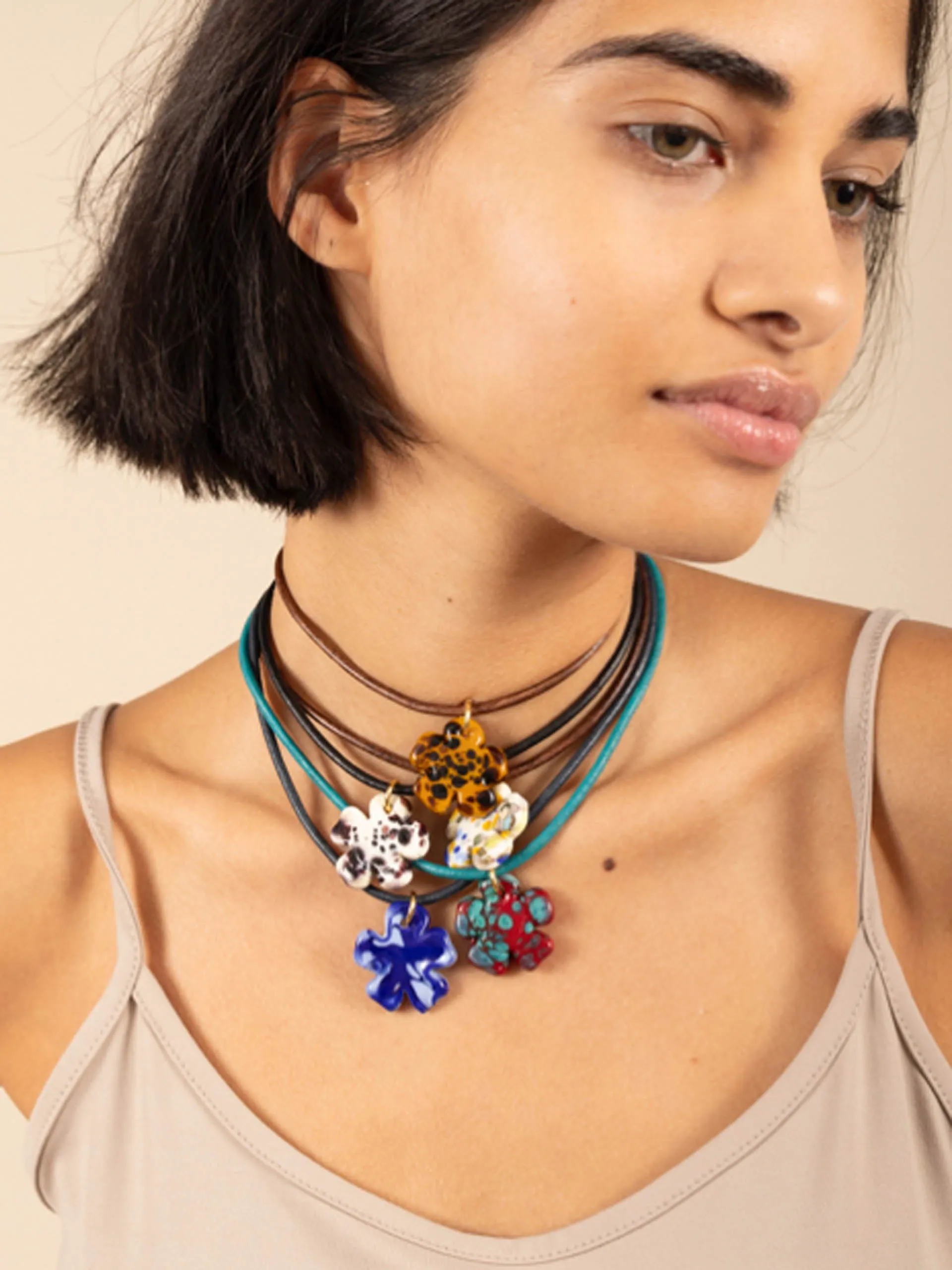 Black and white clover leather cord necklace