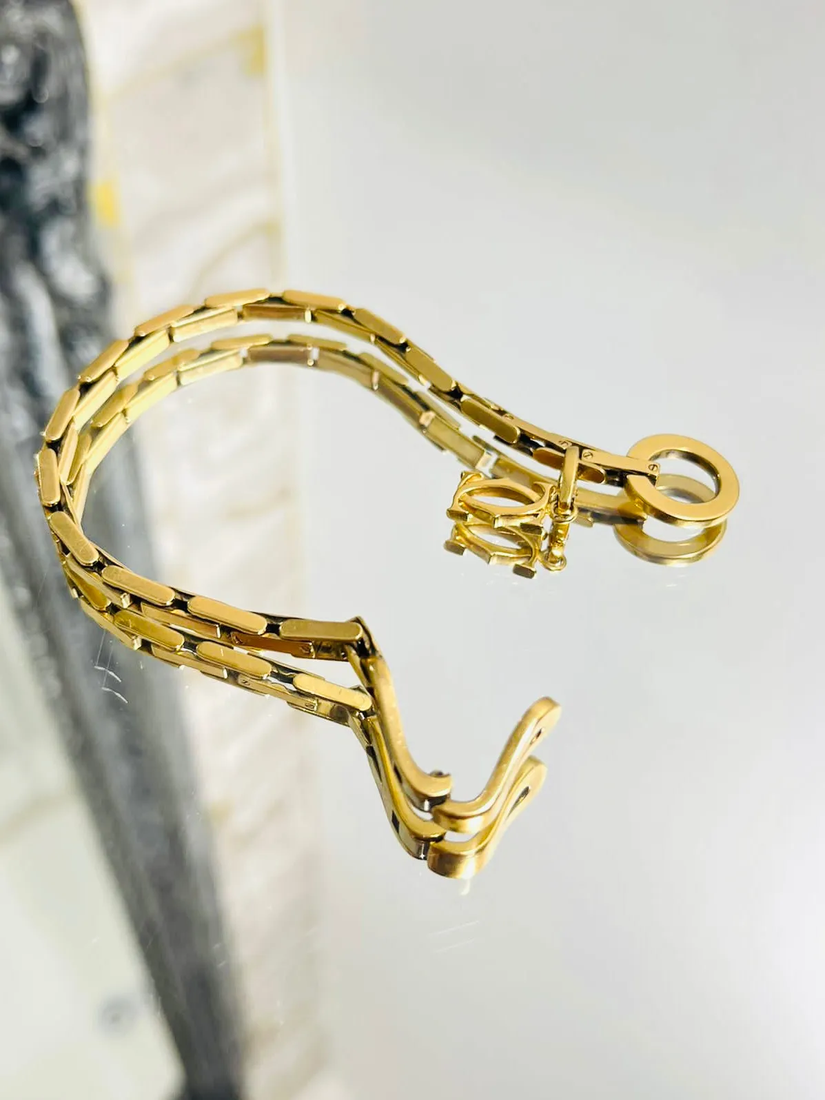 Cartier 18k Gold Agrafe Bracelet & Logo Charm