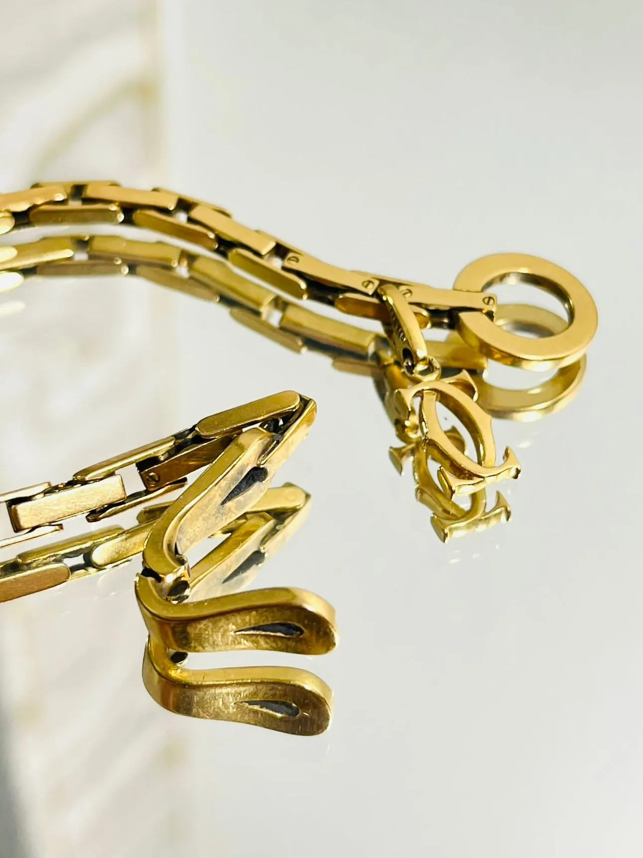 Cartier 18k Gold Agrafe Bracelet & Logo Charm